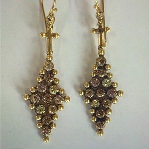 Virgin Saints & Angels Pixie look earrings.